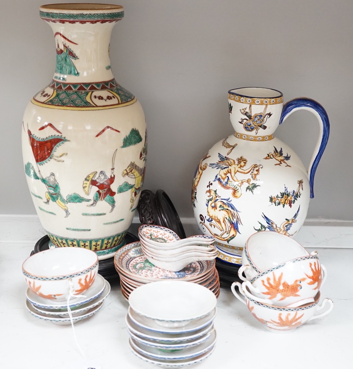 A Gien pottery jug, a Chinese crackle glaze baluster vase, egg-shell tableware and three Oriental wood stands